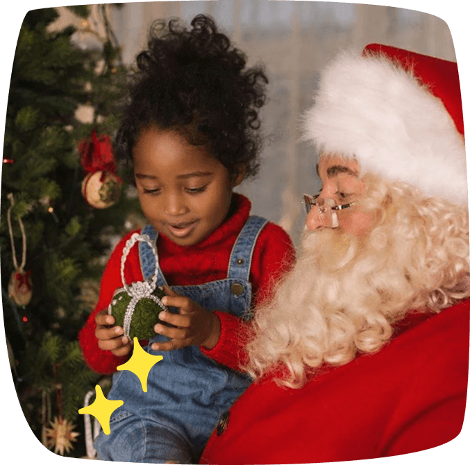 babboi natale con bambina in braccio