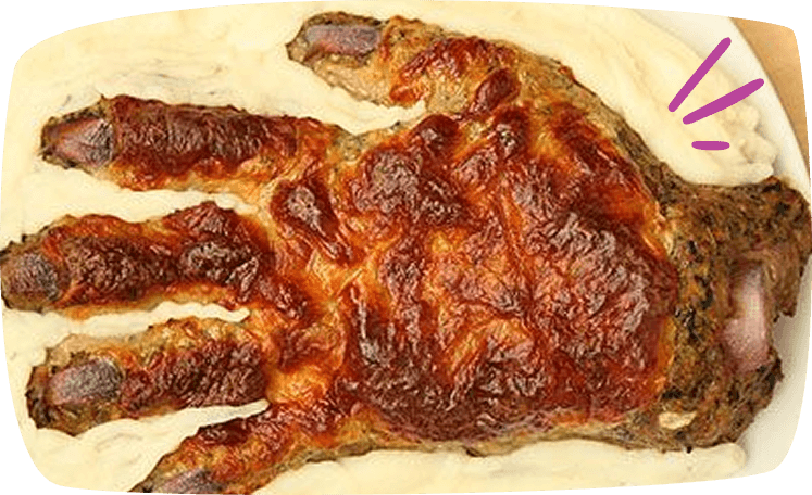 polpettone o forma di mano su letto di purè